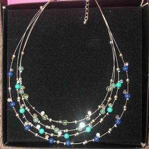 Multi layered pearled necklace